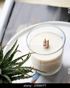 Natural new soy wax candle with wooden wick in clear glass jar Stock ...