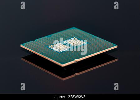 A current computer processor is reflected on a black background Stock Photo