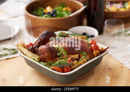 Close-up of dish on dining table roasted chicken with vegetables serving for dinner Stock Photo