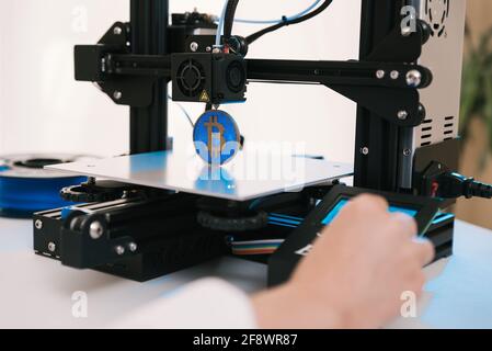 New generation of 3D printing machines printing a plastic part. For use in small spaces, offices or private use Stock Photo