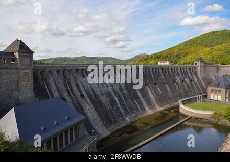 Dam at Edersee at low tide, with green mountains in the background Stock Photo