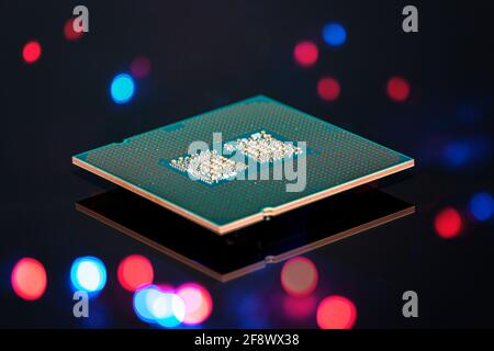 A current computer processor is reflected on a black background Stock Photo