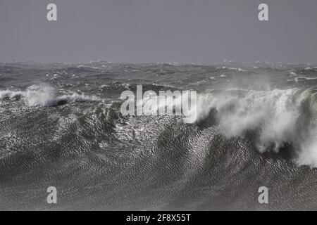 Stormy breaking sea wave against dark sky. Northern portuguese coast during winter. Stock Photo