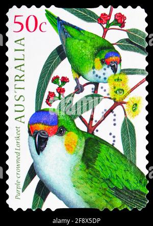 MOSCOW, RUSSIA - OCTOBER 1, 2019: Postage stamp printed in Australia shows Purple-crowned Lorikeet (Glossopsitta porphyrocephala), Parrots serie, circ Stock Photo