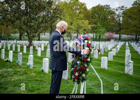 Arlington, United States Of America. 14th Apr, 2021. U.S President Joe Biden places a wreath in Section 60 at Arlington National Cemetery as he pays respect to service members who died in the Afghan and Iraq wars April 14, 2021 in Arlington, Virginia. Earlier Biden announced that he will be withdrawing all forces from Afghanistan by September 11th. Credit: Planetpix/Alamy Live News Stock Photo