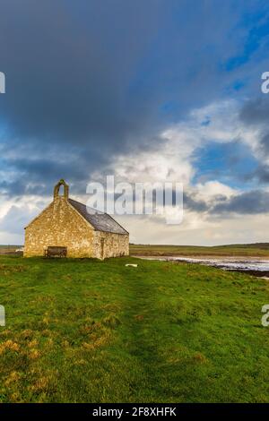 St. Cwyfan's Church in the Sea at Porth Cwyfan in Anglesey, Wales Stock Photo