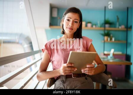 Portrait of cheerful woman using portable pc for blogging in social networks Stock Photo