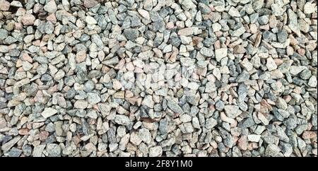 Gray rubble background of many small gravel stones top view Stock Photo