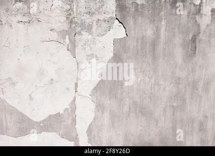 Cracked weathered concrete street wall textured background Stock Photo