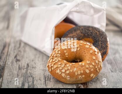Mixed Fresh Bagels on a wooden table. High quality photo. Stock Photo