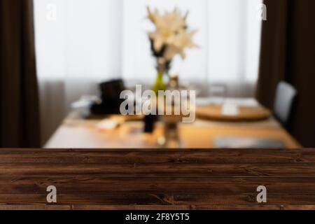 Modern luxury kitchen dining table black golden tone with wooden tabletop space for display or montage your products. Stock Photo