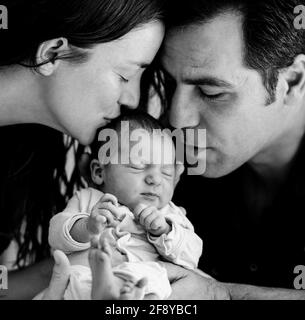 Portrait of parents with newborn baby Stock Photo