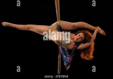 Woman dancing with grace as aerialist Stock Photo