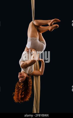 Woman dancing with grace as aerialist Stock Photo