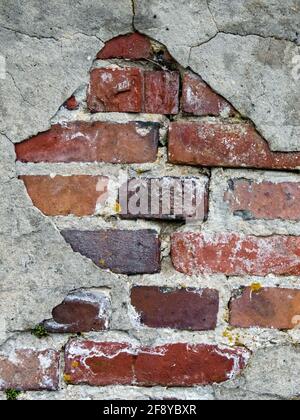 Old dilapidated wall made of brick Stock Photo
