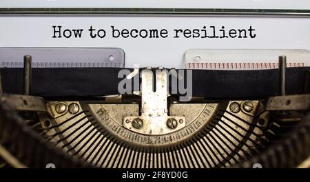 How to become resilient symbol. Concept words 'How to become resilient' typed on retro typewriter. Business, motivational and how to become resilient Stock Photo