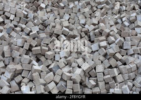 Building Material: Heap of Paving Stones, Background Texture. CUBE Stock Photo