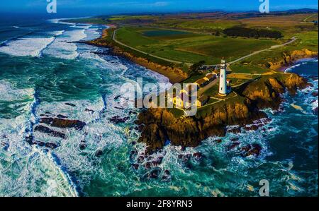 Aerial view of waves crashing against cliffs with Pigeon Point Lighthouse, Pescadero, California, USA Stock Photo