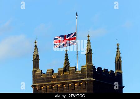 The Union Jack flag flying at half mast above St Mary's Church in Swillington,Leeds following the death of Prince Phillip The Duke of Edinburgh 9/4/21 Stock Photo