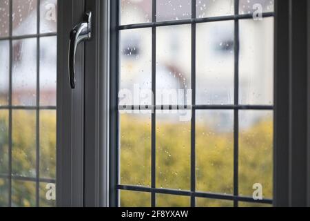 View through a lead glass window on a rainy day in England, United Kingdom Stock Photo