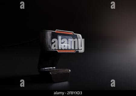 Black webn video camera on black background with copy space. Stock Photo