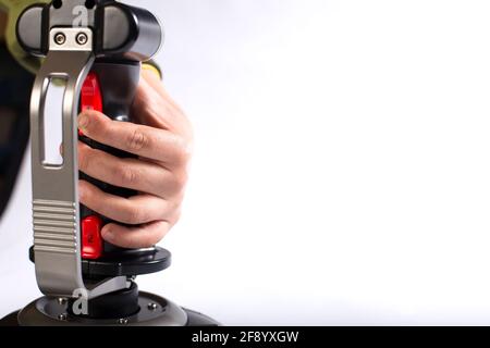 Child hand playing with joystick for aircraft control on a white background with copy space. Stock Photo