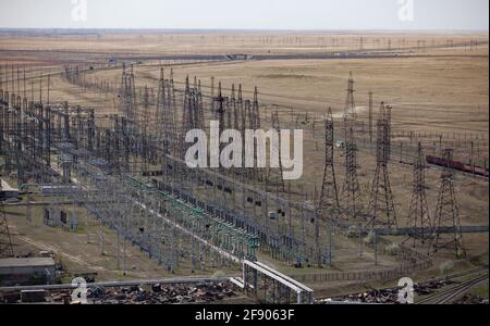 View on Ekibastuz power plant, Kazakhstan. White steam of plant chimney on  blue sky Stock Photo - Alamy