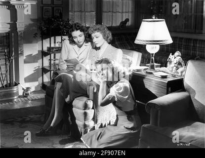 JENNIFER JONES CLAUDETTE COLBERT and SHIRLEY TEMPLE in SINCE YOU WENT AWAY 1944 director JOHN CROMWELL from book by Margaret Buell Wilder screenplay David O. Selznick music Max Steiner producer David O. Selznick  Selznick International Films / Vanguard Films / United Artists Stock Photo