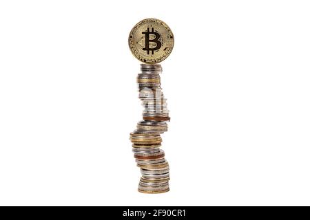 Bitcoin at the top of a pyramid of coins from different countries on a white isolated background Stock Photo