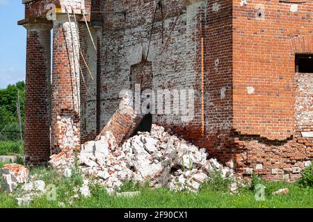 Dilapidated columns of an old brick church in Russia Stock Photo