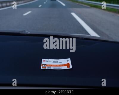 Toll Road operated by Area in Chambery Nord placed on the car dashboard Stock Photo