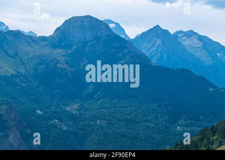 Auris, Isere, France - August 22, 2019: Scenic view of Alpine landscape under the clouds in Northern Alps, Isere department, France Stock Photo