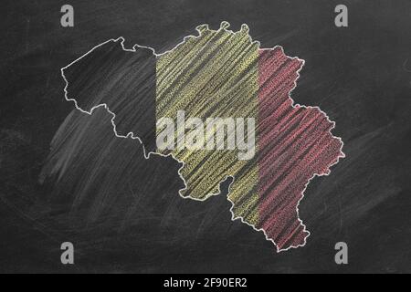 Country map and flag of Belgium drawing with chalk on a blackboard. One of a large series of maps and flags of different countries. Education, travel, Stock Photo