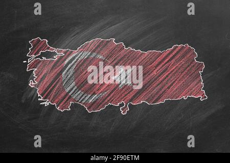 Country map and flag of Turkey drawing with chalk on a blackboard. One of a large series of maps and flags of different countries. Education, travel, Stock Photo