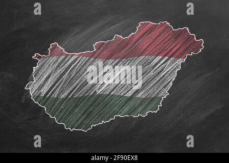 Country map and flag of Hungary drawing with chalk on a blackboard. One of a large series of maps and flags of different countries. Education, travel, Stock Photo