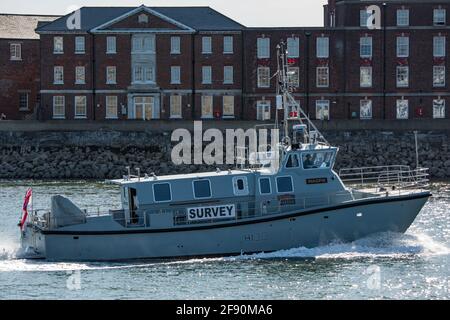 The Royal Navy inshore survey motor launch HMS Magpie (H130) returning to Portsmouth Harbour, UK on the afternoon of Sunday the 24th May 2020, after carrying out surveys of the anchorages in The Solent. Stock Photo
