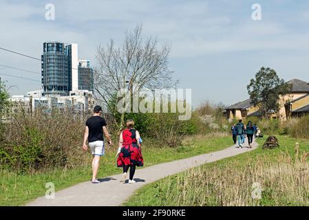 Park or Parkland Walk Extension Gillespie Park with people walking along the path in the spring sunshine Highbury, London Borough of Islington Stock Photo