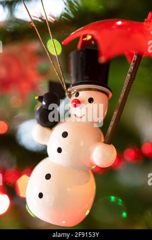 snowman Christmas ornament on a tree Stock Photo