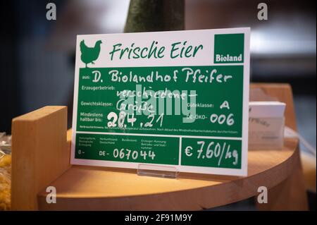 Bad Soden, Germany. 14th Apr, 2021. "Fresh eggs" is written on a sign in the farm shop of the organic farm Pfeifer in the Altenhain district. Bioland, the largest organic growers' association in Germany, is now celebrating its 50th birthday. (to dpa: "Organic food in transition from a fringe phenomenon to a mass product") Credit: Sebastian Gollnow/dpa/Ģ����ý Live News Stock Photo