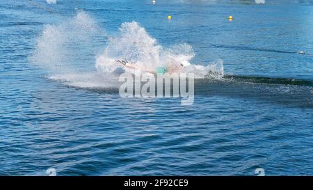 Mackay, Queensland, Australia - April 2021: Man learning to wakeboard at a cable ski park Stock Photo