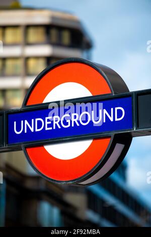 The famous iconic London Underground tube station sign. The sign proudly shows the red roundel with blue bar. Stock Photo