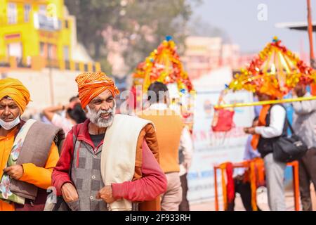 HARIDWAR, INDIA, FEBRUARY 2021 : Portrait of Indian Sadhu in traditional saffron dress participating in Kumbh festival. Stock Photo