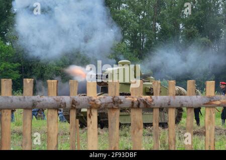 Shooting from a tank, reconstruction of the Civil War of 1919 in Russia. Russia, Moscow region, Nelidovo 15 July 2017 Stock Photo