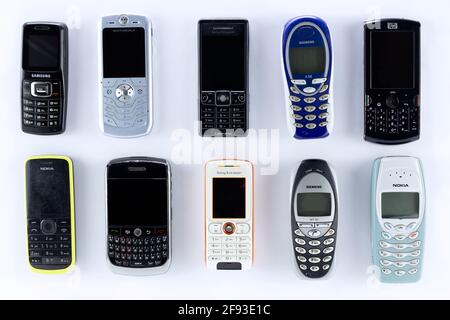 Prague, CZ- 21 January 2021: Various types of Brand and generations old mobile phones. Editorial Stock Photo