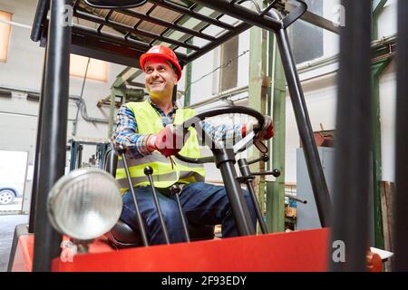 Forklift truck drivers drive when loading and unloading in the shipping company Stock Photo