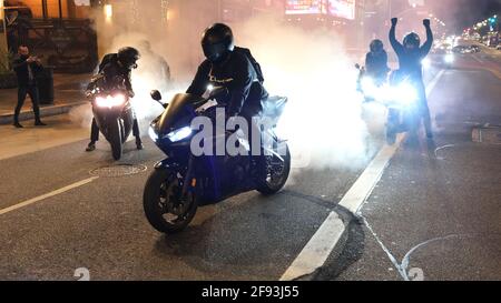 Los Angeles, CA, USA. 16th Apr, 2021. Motorcyclists perform burnouts during a protest calling for justice for Daunte Wright after he was shot by police officers.. Credit: Young G. Kim/Alamy Live News