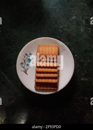 Rectangular biscuits in plat selective focus on subject Stock Photo