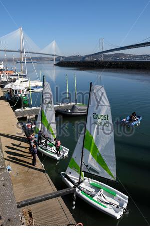 South Queensferry, Scotland, UK. 16th Apr 2021.  Cool clear and sunny at South Queensferry and Forth Estuary. With the easing of the Covid-19 Coronavirus lockdown measures and travel restrictions across Scotland from today, people start to visit and enjoy the outdoors at the usual visitor hotspots. Sailing lessons at Port Edgar marina. Credit: Craig Brown/Alamy Live News Stock Photo