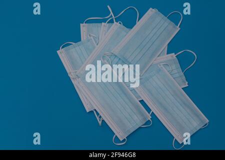 Protective face masks on a blue background. layout Stock Photo