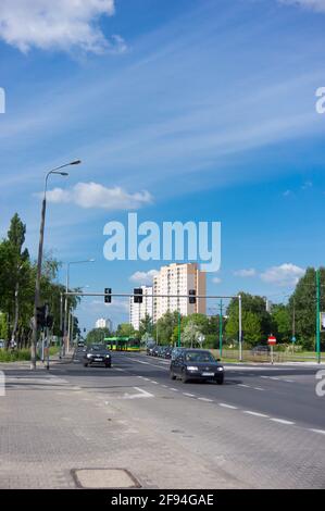 POZNAN, POLAND - Oct 18, 2015: Cars driving on a street with traffic lights Stock Photo